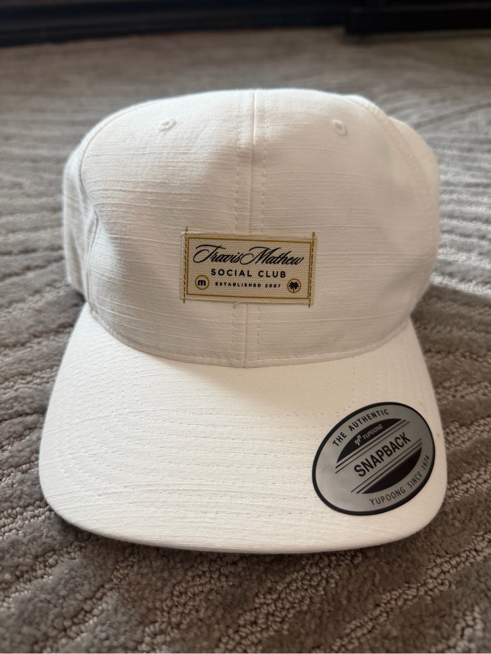 Travis Mathew White Hat with Gold Patch
